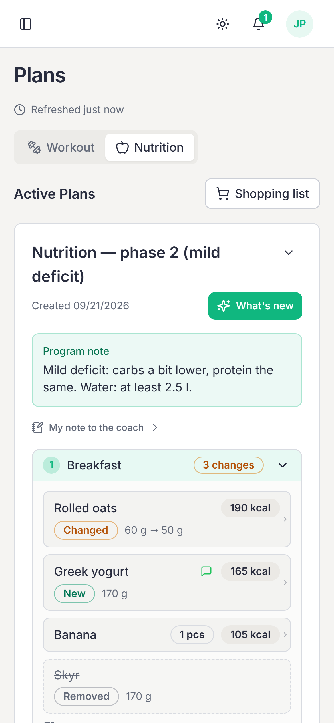 The client’s nutrition plan on a phone with “What’s new” on: added, removed and changed foods.